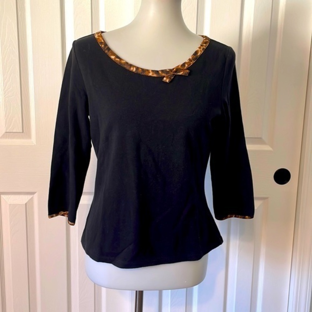Liz Claiborne 3 quarter sleeve blouse with leopard trim around neck and sleeves.